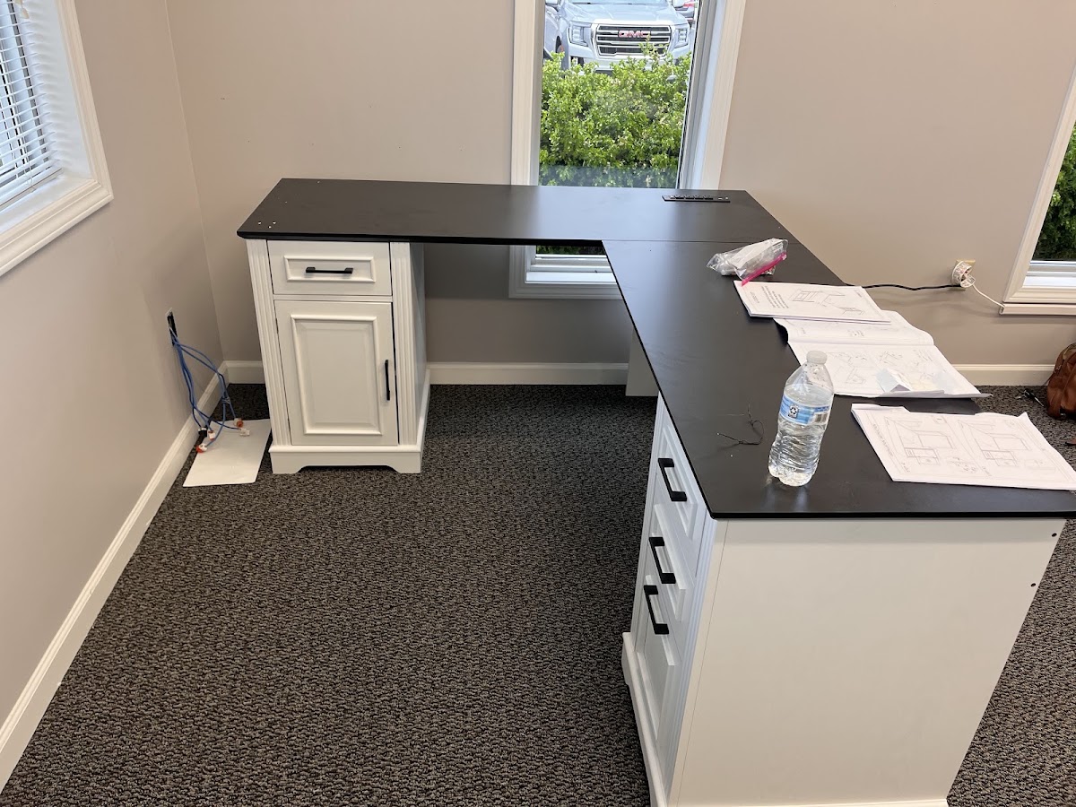 L shaped built in desk with cabinets