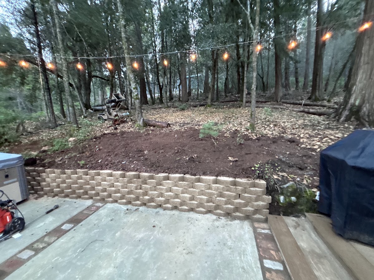 Block retaining wall and regraded backyard